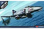 Box art for Academy 1/48 scale USMC F-4B/N Phantom model kit, featuring an illustration of the jet flying over an aircraft carrier at sea.
