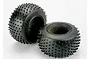 Two black Traxxas 2.2 inch Pro-Trax spiked RC tires with foam inserts, shown against a plain white background.