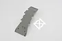 Traxxas grey plastic front skid plate and a separate stainless steel reinforcement plate on a white background.