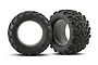 Two black Traxxas 3.8 inch Maxx monster truck tyres with aggressive tread patterns and foam inserts, shown against a white background.