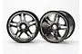 Two Traxxas 3.8 inch split-spoke RC monster truck rims in a satin chrome finish, shown against a plain white background.