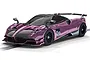 A 1/32 scale Scalextric Pagani Huayra Roadster BC slot car in metallic purple with black accents, displayed on a slot car track.