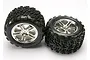 Two Traxxas 3.8 inch Talon monster truck tires pre-glued onto chrome split-spoke wheels, shown against a plain white background.