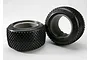 Two black Traxxas Response Pro RC monster truck tyres with grey foam inserts, shown against a plain white background.