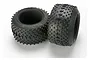 Two black Traxxas 3.8 inch RC monster truck tyres with square tread patterns and foam inserts, shown against a white background.