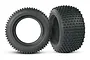 Two black Traxxas Alias 2.8 inch RC monster truck tyres with foam inserts, shown from side and angled views against a white background.