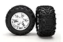 Two Traxxas 3.8 inch Maxx monster truck tires pre-mounted on shiny chrome Geode wheels, shown against a white background.