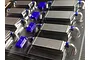 A plastic sprue containing several unpainted 1/10 scale RC intercooler parts and small blue components.