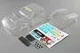 Unpainted clear polycarbonate body shell parts for a Losi 1/10 Baja Rey Ford Raptor, including decals, grille, and mounting hardware.