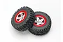 Two Traxxas 2.2/3.0 inch off-road RC wheels with black rubber tyres and satin chrome and red rims against a white background.