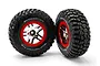 Two Traxxas RC short course wheels with BFGoodrich Mud-Terrain T/A KM2 tyres mounted on chrome and red split-spoke rims.