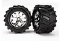 Two Traxxas 2.8 inch Maxx Chevron tyres pre-glued onto chrome-plated All-Star rims, shown against a plain white background.