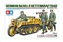 Box art for Tamiya 1/35 scale German Sd.Kfz.2 Kettenkraftrad model kit, featuring a painted illustration of the vehicle with three German soldier figures.