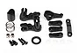 Traxxas steering bellcrank set components including black plastic arms, metal spring, screws, and washers on a white background.
