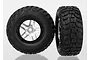 Two Traxxas 2.2/3.0 inch Kumho Road Venture MT tires pre-glued onto satin chrome split-spoke wheels against a white background.