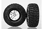 Two Traxxas 2.2/3.0 inch Kumho Road Venture MT tyres mounted on satin chrome split-spoke wheels, shown from front and side angles.