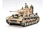 A fully assembled and painted 1/35 scale Tamiya German Panzerkampfwagen IV Ausf.G tank model with four crew figures, set against a plain white background.
