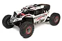 Losi Super Rock Rey V2 1/6 scale RC rock racer in white with black and red accents, featuring Raceline wheels and off-road tires.