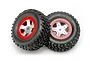 Two Traxxas 1/16 Slash off-road tyres mounted on satin chrome and red wheels against a white background.