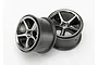 Two Traxxas 2.2-inch Gemini rims with a black chrome finish, shown from a front-angled perspective against a plain white background.