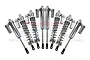 A set of eight silver aluminium piggyback shock absorbers for RC cars arranged in a fan shape against a white background.