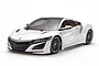A 1/10 scale Tamiya TT-02 RC car featuring a white Honda NSX body shell on a white background.