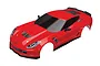 A red Traxxas 1/10 scale Chevrolet Corvette Z06 RC car body shell, pre-painted with black windows and trim, shown from a high-angle perspective.