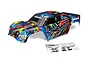 Traxxas X-Maxx 8S RC truck body shell with a blue, red, and yellow Rock 'n Roll paint scheme, including a decal sheet.