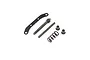 A set of black metal RC steering hardware components including a curved plate, threaded shaft, pin, coil spring, and two bushings on a white background.