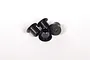 A close-up view of four small black metal flanged bushings arranged on a white background.