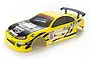 A yellow 1/10 scale RC drift car body shell with black decals and a rear spoiler, isolated on a white background.