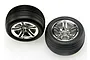 Two Traxxas 2.8-inch Alias ribbed front tyres pre-mounted on chrome twin-spoke wheels against a white background.