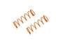 Two orange Kyosho RC shock springs lying on a white background.