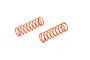 Two bright orange coil springs for RC car shock absorbers isolated on a white background.