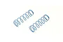 Two light blue Kyosho RC shock springs lying on a white background.