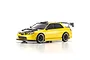 A studio shot of a metallic yellow Kyosho Mini-Z Subaru Impreza RC drift car with a black carbon fiber style hood, roof scoop, and rear wing.