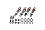 A set of four Kyosho Fazer Mk2 short shock absorbers with red caps, white springs, and black bodies, plus included mounting hardware and spacers.