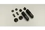 A set of black plastic RC shock absorber components including threaded shock bodies, pistons, rod ends, and spring retainers on a white background.