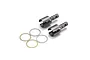 A set of two metal differential outdrives and four thin circular shims or washers on a white background.