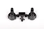 A pair of black plastic Axial C-hub carriers still attached to their original injection molding sprue, isolated on a white background.