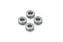 A set of four small metal shielded ball bearings arranged in a diamond pattern on a white background.