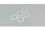 Five thin, circular metal shims arranged on a plain grey background.