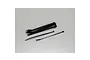 A collection of black plastic zip ties on a plain white background, with a few loose ties separated from the main bundle.