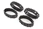 Four black Traxxas TRX-4 Traxx deep-terrain rubber tracks arranged on a white background.