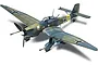 A finished scale model of a Junkers Ju 87G-1 Stuka dive bomber with camouflage paint and under-wing cannons.