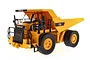 Diecast Masters CAT 770 RC mining truck in yellow and black, featuring detailed cab, railings, and large treaded tires on a white background.