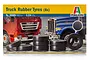 Italeri 1/24 scale truck rubber tyres model kit packaging showing eight black rubber tyres in front of images of model trucks.