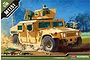 Box art for Academy 1/35 scale M1151 Enhanced Armament Carrier model kit showing a tan military vehicle in a desert environment.