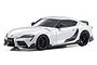 A studio shot of a metallic white Kyosho Mini-Z Toyota GR Supra TRD Aero RC car on a plain white background.