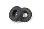 Two black Kyosho RC truck tyres with a tread pattern, shown against a plain white background.